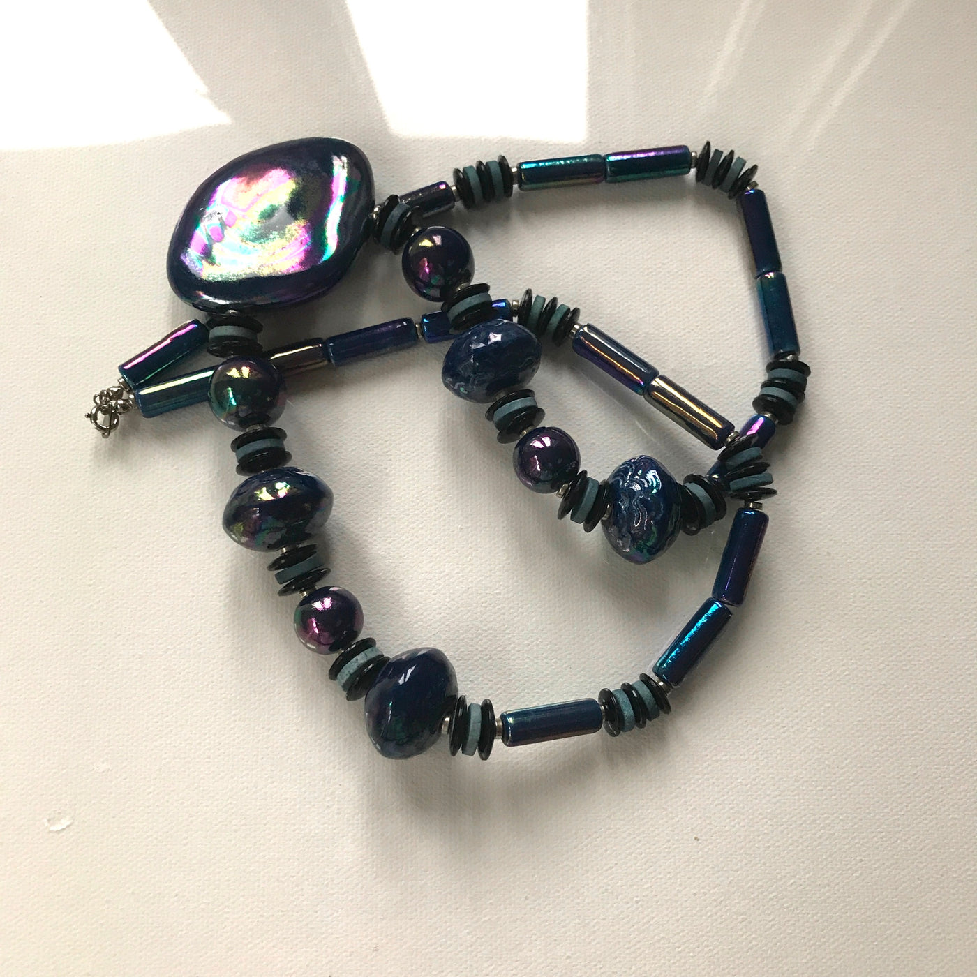 28" Vintage Blue Irridesent Glass Necklace with Medallion JAPAN Chrome Clasp